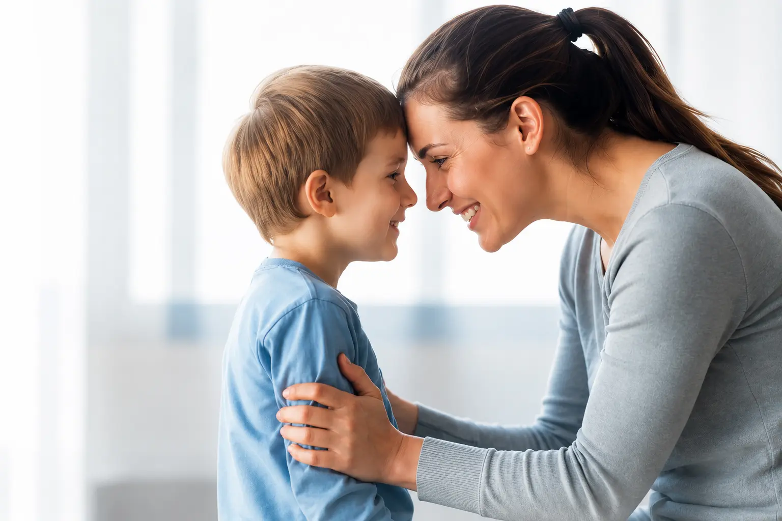 A carer and child sharing a warm, trusting moment — the foundation of therapeutic care at New Beginnings