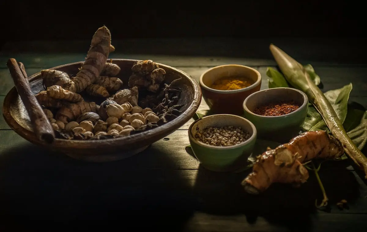 An assortment of Indian spices in wooden bowls